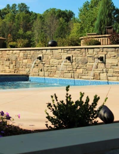 pool with fountain pouring down