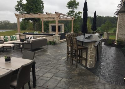 Backyard with pergola, tv, and outdoor kitchen