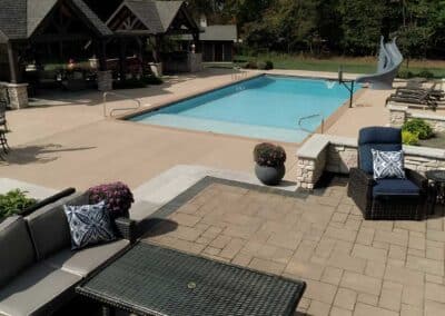 An elevated seating area allows full visual enjoyment of activity in the pool while delineating a splash-free zone.