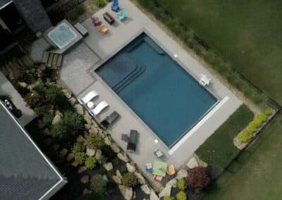 The placement of the pool and landscaping complements the home’s footprint and maximizes the homeowner’s use of outdoor space.