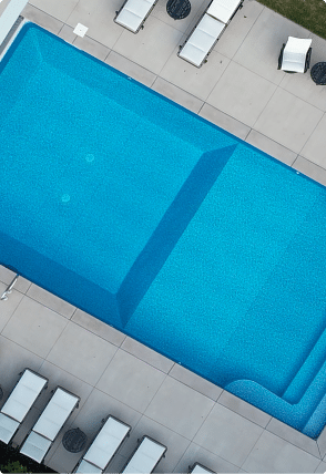 Rectangle 285 close up overhead view of a crystal blue swimming pool