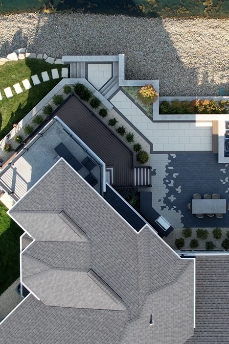 aerial-gravel aerial view of a home's roof and patio highlighting the different shapes and textures of the stone and landscaping