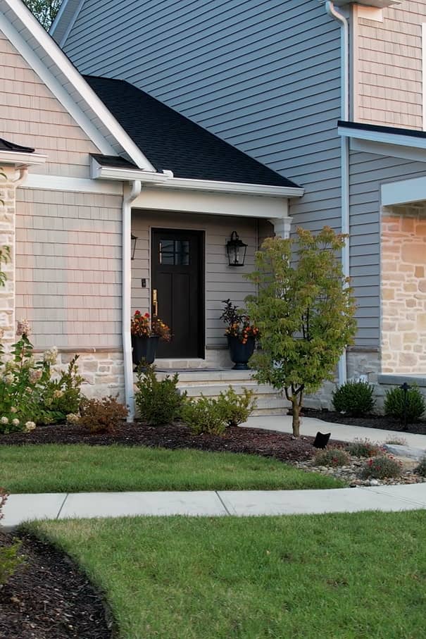 entryway-landscaping The front door of a residence showcasing the landscaping and walkway
