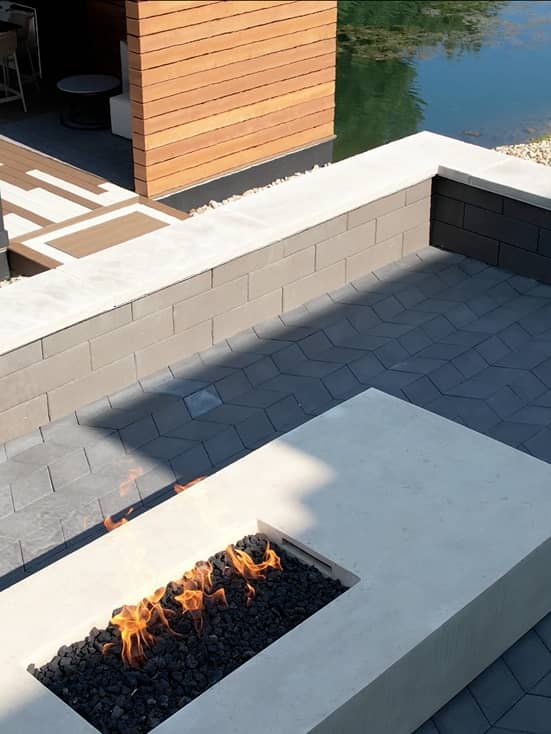 fire-table overhead shot of a pool with a stone staircase leading into clear blue water