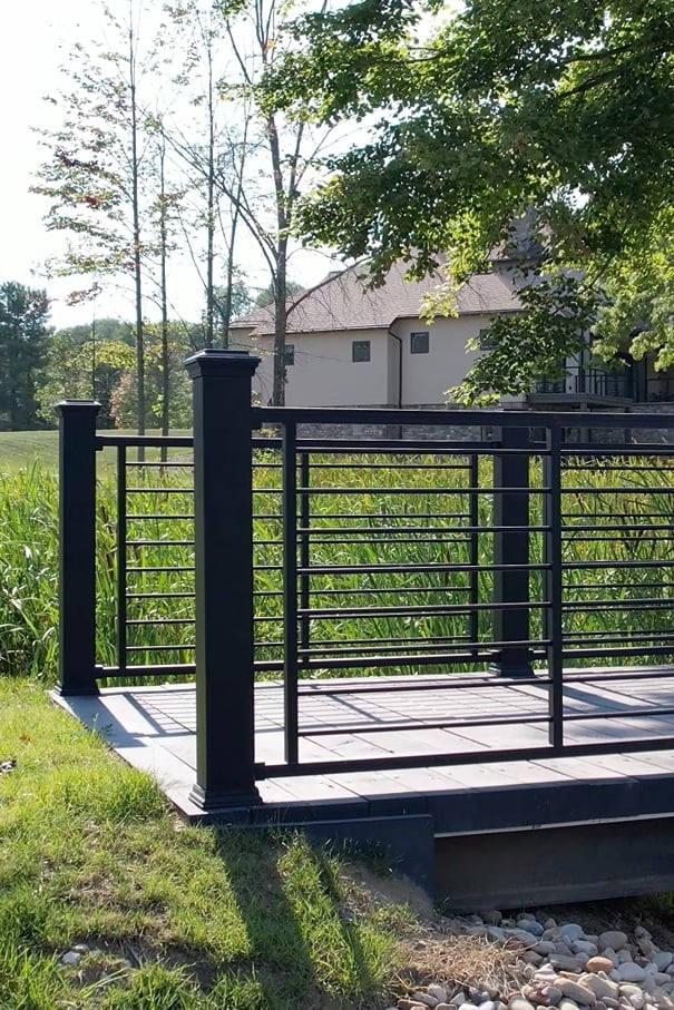 landscaping-2 overhead shot of a pool with a stone staircase leading into clear blue water