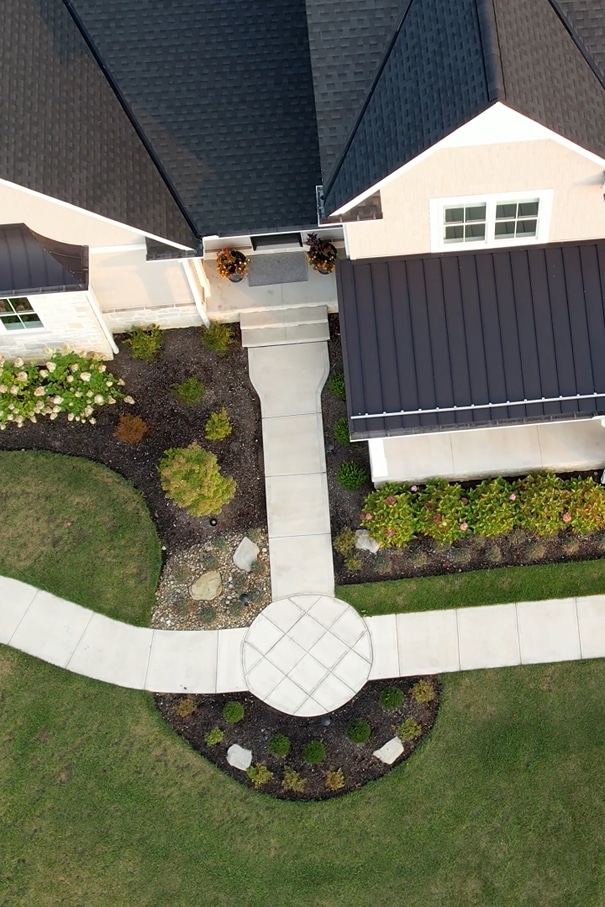 landscaping-4 overhead shot of a pool with a stone staircase leading into clear blue water